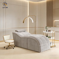 Lit de massage compressé moderne pour salon de beauté, matelas incurvé pour spa et soins du visage
