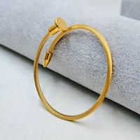 Bracelet jonc ouvert unisexe en acier inoxydable doré/argenté/noir avec breloque clou