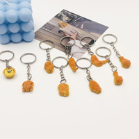 Porte-clés créatif et amusant en forme de nuggets de poulet 3D, pattes de poulet, ailes de poulet, porte-clés de sac, porte-clés unique et mignon en imitation PVC, porte-clés alimentaire