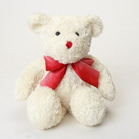 Ours en peluche doux blanc avec un joli nœud rouge en forme de ruban