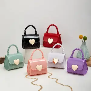 Ragazze Color caramella Mini borsette e borsette a forma di cuore da donna con bottone a tracolla Mini borsa a mano per bambini in Silicone con manico in corda