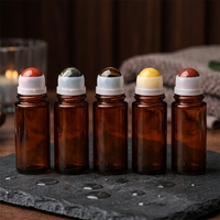 Flacon roll-on en verre épais rechargeable de 30 ml/50 ml avec bouchon à vis, rouleau en pierre, estampage à chaud doré et sérigraphie pour huiles essentielles et soins de la peau