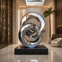 Sculpture en acier inoxydable poli miroir, anneau entrelacé, grand nœud, statue d'art métallique pour l'intérieur moderne des bâtiments commerciaux