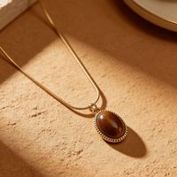 Collier vintage en pierre œil de tigre, accessoire polyvalent