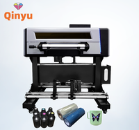 Nouvelle imprimante d'autocollants UV DTF A2 Qinyu haute vitesse rouleau à rouleau avec double tête d'impression XP600 et laminateur, garantie 1 an