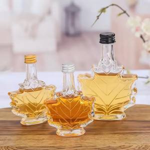 Bouteilles de diffuseur en verre en forme de <span class=keywords><strong>feuille</strong></span> <span class=keywords><strong>d</strong></span>'érable de luxe de 50ml 100ml 250ml pour sirop contre la toux vin whisky Gin boisson avec couvercle en aluminium - Product Image 1