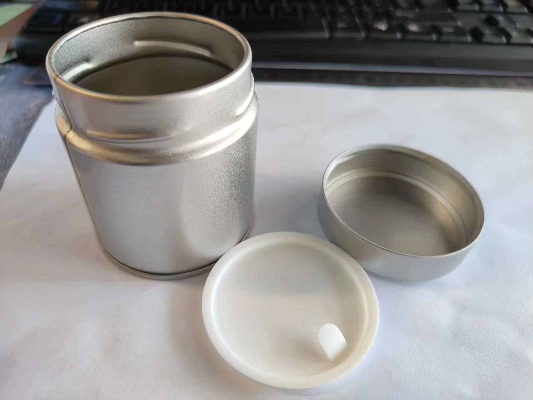 silver with inner plastic lid