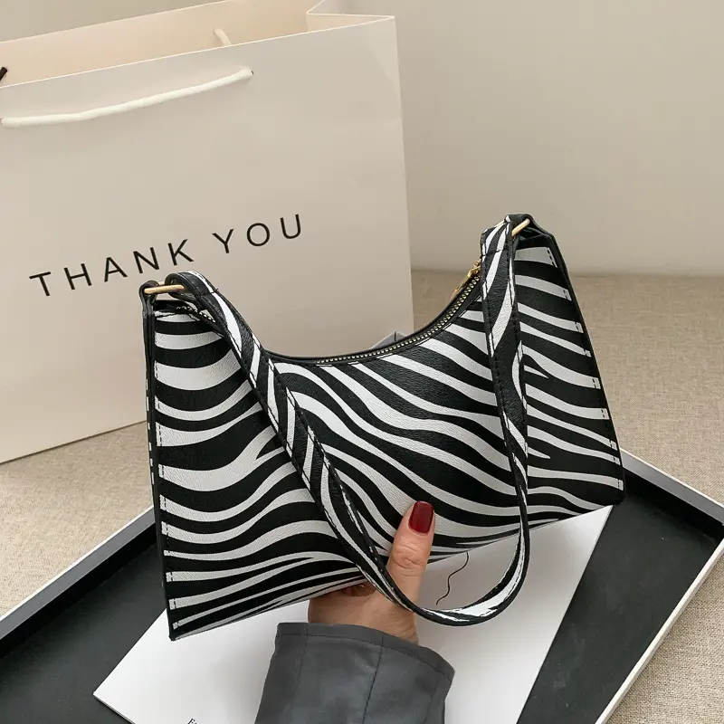 Moda Zebra baskı kadınlar lüks çanta PU deri basit koltukaltı omuz çantaları kadın günlük tasarım kılıf çanta kılıfı
