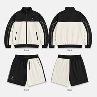 Conjunto Deportivo de Dos Piezas para Hombre con Bloques de Color en Contraste, Chaqueta con Cremallera y Cuello Alto, Pantalones Cortos, Bolsillos Inclinados, Diseño Asimétrico