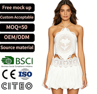 Ensemble haut court blanc à col halter avec découpes en dentelle et mini-jupe à volants pour femme, tenue de plage estivale, vêtements de mode