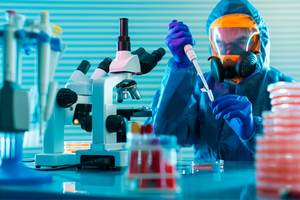 Scientifique travaillant dans un laboratoire de pointe, utilisant un microscope et une pipette, tout en portant une tenue de protection complète pour la recherche biologique. - Product Image 3