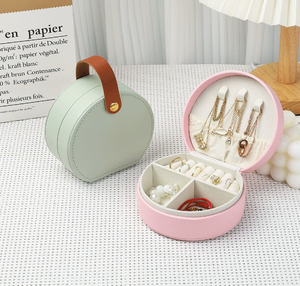 <b>Round</b> portable jewelry <b>box</b> made of premium PU leather with soft velvet lining and precise stitching process - Product Image 5