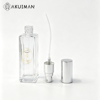 Flacon de parfum rectangulaire transparent en verre, bouchon métallique argenté, logo personnalisé, flacon pulvérisateur à fine brume, directement de l'usine