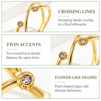 Bague double boucle en zircon plaqué or 14 carats pour femme avec motif croisé et ensemble de fleurs jumelles orné d'accentuations rondes transparentes