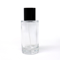 Flacon de parfum en verre transparent rond de 25 ml, 50 ml, 100 ml, flacon atomiseur de parfum vide avec bouchon côtelé noir et argenté