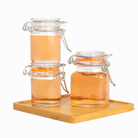 Penjualan laris 100 ml kecil kosong penyimpanan dapur Jam makanan bening kaleng bumbu penyimpanan kaca Mason Jar dengan tutup atas klip kedap udara