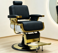 Fauteuil de barbier de luxe rétro avec cadre en métal plaqué or noir, coutures verticales, inclinable hydrauliquement