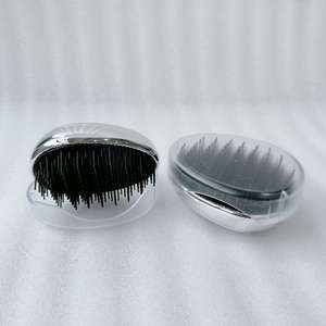 Cepillo de pelo en forma de huevo Peine desenredante de plástico Cabeza Masaje del cuero cabelludo Peine Salón Ducha Herramientas de peinado - Product Image 6