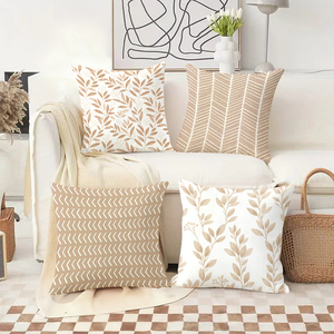 Những chiếc gối trang trí ấm cúng với họa tiết lá và hình học trên chiếc ghế sofa trang trí lễ hội. - Product Image 2