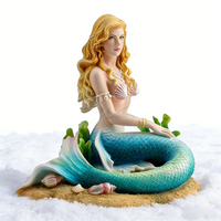 Sculpture de sirène en résine artistique, figurine de sirène assise sereine avec détails de coquillages et d'algues