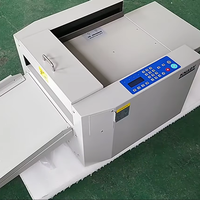 Machine à rainer et à perforer le papier numérique de bureau