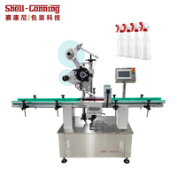 Machine d'étiquetage automatique professionnelle pour bouteilles et canettes de l'industrie alimentaire, personnalisable en usine, avec système de serrage automatique et étiquetage plan.