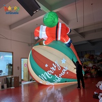 Père Noël gonflable géant en plein air dans un ballon à air chaud, modèle personnalisé, grande décoration de Noël pour la promotion d'événements