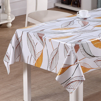 Nappe en vinyle imprimée au laser RNPT avec des feuilles tropicales en vert et rouille, support en PVC et tissu blanc pour tables à manger