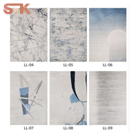 Tapis moderne en polypropylène ultra doux de 12 mm d'épaisseur, motif bleu glacé, effet aquarelle dégradé, brillance soyeuse Liuli