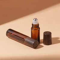 Emballage LK, flacons de parfum en verre rectangulaires mats brun foncé personnalisés haut de gamme de 10 ml, couvercles en bois foncé et bambou, rouleau en acier inoxydable