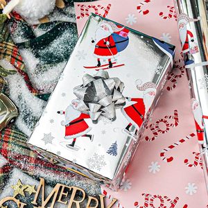 17in Aluminum coated Christmas gift wrapping <b>paper</b> with Santa Claus skiing <b>pattern</b> Double sided printed candy cane Customizable - Product Image 1