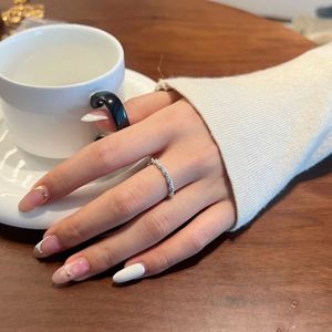 Dylam Exclusive Design High Jewel Rhodium Plated <b>925</b> Sterling <b>Silver</b> 0.245ct D VVS1 Moissanite Twisted Interlock Band <b>Rings</b> - Product Image 4