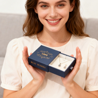 Boîte à bijoux rigide haut de gamme en carton écologique de marque ZX, avec logo personnalisé et doublure en éponge, idéale pour les mariages et les cadeaux personnalisés.
