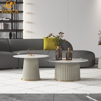 Table basse moderne en marbre naturel avec structure en acier inoxydable, design durable, style luxe léger pour villas, appartements et salons