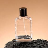 Bouteille d'huile essentielle en verre bouclé de forme de luxe vide au design unique Bouteille d'eau parfumée avec couvercle noir
