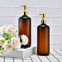 Bouteille de pompe vide de luxe en plastique PET ambré 120ml 250ml 500ml givré sérigraphiée en soie couvercle d'huile en or logo personnalisé shampooing cheveux