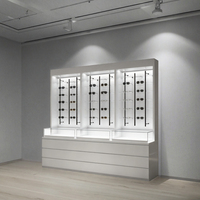 Comptoir de présentation de lunettes optiques en acier inoxydable avec éclairage LED pour magasin de vente au détail de lunettes moderne