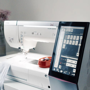 Janome Chân Trời Bộ nhớ thủ công 12000 | 1000 mũi khâu/min máy thêu với thiết kế không dây nhập khẩu - Product Image 1