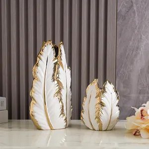 Venta al por mayor de lujo nórdico moderno esmaltado plátano hoja de plátano hogar Hotel decorativo negro blanco y oro jarrón de cerámica para flor