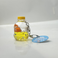 Porte-clés en acrylique avec bouteille flottante en forme de voilier bleu océan, dessin animé, exquis, cadeau pour enfants, injection d'huile liquide, bouteille à la dérive, vente en gros