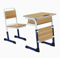 Ensemble table et chaise d'école réglables en hauteur en mélamine avec boîte à livres perforée et structure en acier pour salle de classe primaire