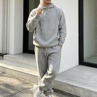 Setelan hoodie dan celana jogger oversized streetwear warna hitam, model cut out, produsen Cut Out Middleman.