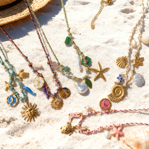 Collier de mode style plage océanique avec pendentif en forme de soleil, de lune et d'étoile de mer en acier inoxydable non ternissant avec perle naturelle Muses Jewels - Product Image 1