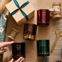 Vela Aromática Navideña AIKUN en Frascos de Vidrio de Colores Rojo, Verde y Ámbar, con Estampado Festivo y Caja de Regalo para Exhibición en Tiendas