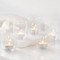 Vente en gros de porte-bougies en verre transparent à base ronde en arc, petits gobelets en verre pour la décoration d'ambiance intérieure