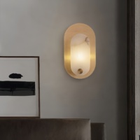 Applique murale moderne en cuivre massif avec design artistique creux et lumière LED pour salon haut de gamme, chambre à coucher ou chevet