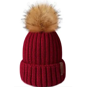 Hot Sale Women Winter Knitted Beanie Hat With Faux Fur Pom Pom Warm Knit Skull Cap Beanie With Logo Custom