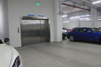 Ascenseur de chargement automobile FUJISJ, efficace et sûr, à entraînement par traction, en acier robuste, design moderne, pour parkings, supermarchés et centres commerciaux