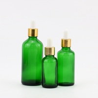 Vente en gros de flacons compte-gouttes en verre transparent bleu vert noir ronds personnalisés avec logo pour cosmétiques et huiles essentielles 30 ml transparent