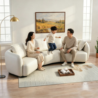 Canapé modulaire en cuir véritable incurvé de luxe à trois places, en forme de L, avec table d'appoint pour maison contemporaine